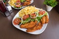 Breaded chicken breast dish Royalty Free Stock Photo