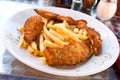 Breaded chicken breast with french fries Royalty Free Stock Photo