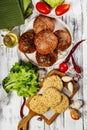 Breaded chicken cutlet with paprika and fresh hamburger buns. Homemade minced poultry cutlets with spices. Fresh lettuce leaves Royalty Free Stock Photo