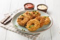 Breaded chicken donuts made from pulled chicken with vegetables and deep fried close-up on a plate. Horizontal Royalty Free Stock Photo