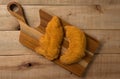 Breaded chicken filet, on a wooden background. top wiew