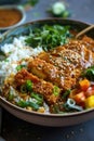 Breaded chicken katsu with curry sauce over rice in a bowl