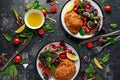 Breaded Chicken Kiev breast stuffed with butter, garlic and herbs served with vegetables in a plate. Royalty Free Stock Photo