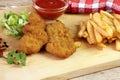 Breaded chicken pieces, french fries