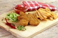 Breaded chicken pieces, french fries