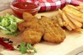 Breaded chicken pieces, french fries