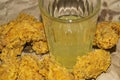 Breaded chicken wings and a glass of lemonade on a grey paper background. Close up Royalty Free Stock Photo