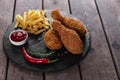 Breaded crispy chicken leg fried french fries sauce Royalty Free Stock Photo