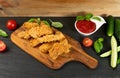 Breaded Deep Fried Fish Nuggets on Wooden Rustic Background Royalty Free Stock Photo