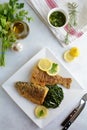 Deep Fried Breaded Whole Fish with Sauteed Greens Royalty Free Stock Photo