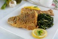 Deep Fried Breaded Whole Fish with Sauteed Greens Royalty Free Stock Photo