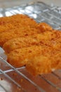 Breaded fish fingers on a grill Royalty Free Stock Photo