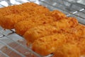 Breaded fish fingers on a grill Royalty Free Stock Photo