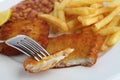 Breaded fish on a fork