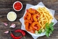 Breaded Fried Shrimps, limes and french fries Royalty Free Stock Photo