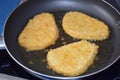 frying Schnitzel still very light Royalty Free Stock Photo