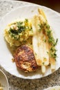 Breaded pork chops with white asparagus and mashed potatoes