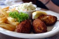 Breaded scampi tails with salad leaves