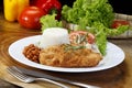 Breaded steak on a meal Royalty Free Stock Photo