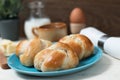 Homemade breadrolls on blue plate