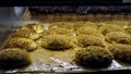 Breads and baked goods large assortment in bakery shelves with fresh baked crispy bread organic Royalty Free Stock Photo