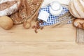 Breads and fresh milk with almond seed on wood table with free space. Breakfast and bakery concept Royalty Free Stock Photo