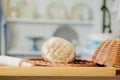 Breads near a wicker basket on a table in a rustic kitchen. Composition in kitchen at the photo studio Royalty Free Stock Photo