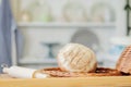 Breads near a wicker basket on a table in a rustic kitchen. Composition in kitchen at the photo studio Royalty Free Stock Photo