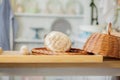 Breads near a wicker basket on a table in a rustic kitchen. Composition in kitchen at the photo studio Royalty Free Stock Photo