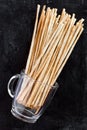 Breadsticks grissini torinesi in glass cup Royalty Free Stock Photo