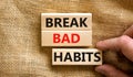 Break bad habits symbol. Concept words Build good habits on wooden blocks on beautiful canvas background. Businessman hand. Copy Royalty Free Stock Photo