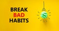 Break bad habits symbol. Green shining light bulb icon. Words `Break bad habits`. Beautiful yellow background. Business,