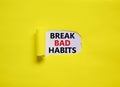 Break bad habits symbol. Words `Break bad habits` appearing behind torn yellow paper. Beautiful yellow background. Business,