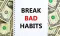 Break bad habits symbol. Words `Break bad habits` on white note. Beautiful background from dollar bills. Business, psychology an