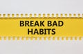 Break bad habits symbol. Words `Break bad habits` on and white yellow paper. Beautiful yellow background. Business, psychology a