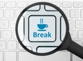 Break button under the magnifying glass Royalty Free Stock Photo