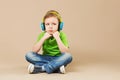 break dance kids. little break dancer showing his skills in dance studio. Hip hop dancer boy performing over studio background Royalty Free Stock Photo