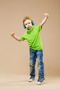 break dance kids. little break dancer showing his skills in dance studio. Hip hop dancer boy performing over studio background Royalty Free Stock Photo