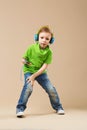 break dance kids. little break dancer showing his skills in dance studio. Hip hop dancer boy performing over studio background Royalty Free Stock Photo