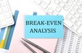 BREAK EVEN ANALYSIS text on blue sticker on chart with calculator and keyboard,Business concept Royalty Free Stock Photo