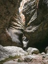 Break in the rock, the entrance of a narrow cave. Interesting rocks forming a narrow passage in the Saltinskij gorge. A unique