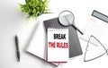 BREAK THE RULES text on white paper. the inscription on the notebook