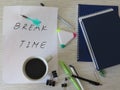 Worktable. Break Time Concept. Relaxation. Office desk table with notebooks, supplies and coffee cup. Top view. Royalty Free Stock Photo