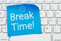 Break Time message on a blue sticky note on a gray computer keyboard