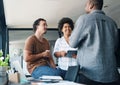 A break to socialise. a group of young businesspeople talking in an office. Royalty Free Stock Photo