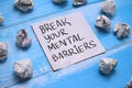 Break your mental barriers, text words typography written on book against wooden background, life and business motivational