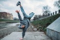 Breakdance performer, upside down motion on street