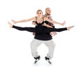 Breakdancer holds ballerina and stands on tiptoes