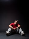 Breakdancer sitting on the floor Royalty Free Stock Photo