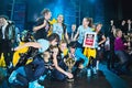 Breakdancers on stage celebrate prize